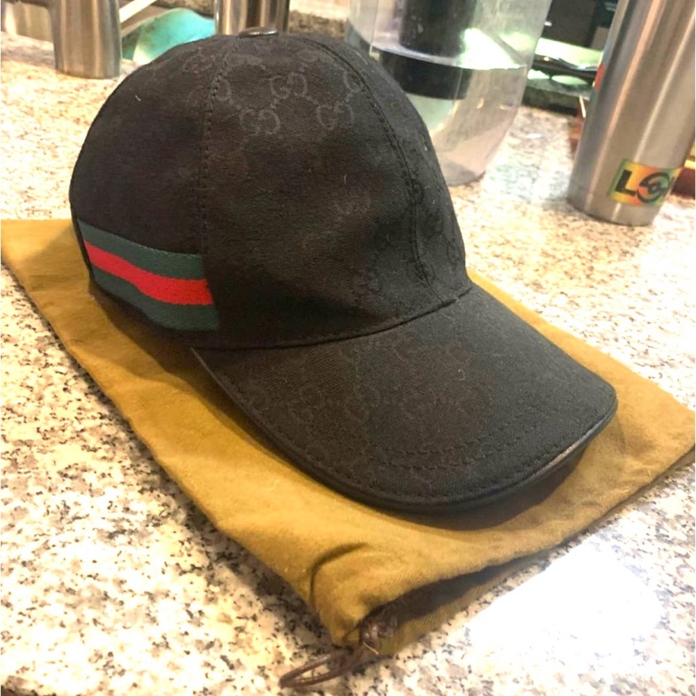Authentic Gucci leather hat in mint condition. Barely worn comes with Gucci bag.